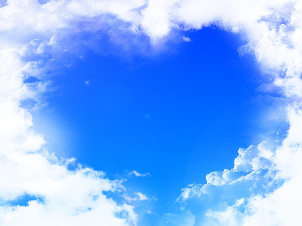白云围成的心形蓝色天空PPT背景图片